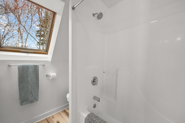 832 Main Rd, Islesboro, ME 04848 - full bath featuring toilet, wood finished floors, shower / washtub combination, and baseboards