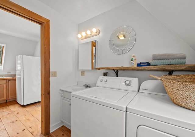 832 Main Rd, Islesboro, ME 04848 - laundry room with independent washer and dryer and light wood-style floors