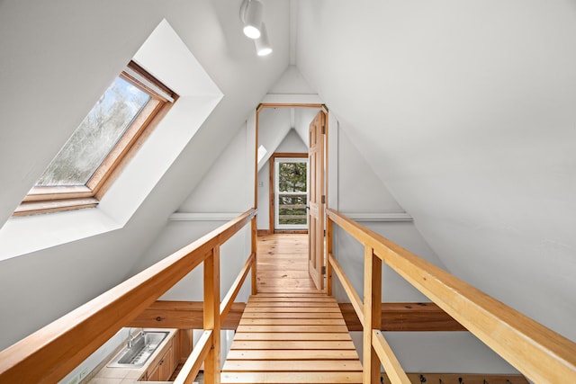 832 Main Rd, Islesboro, ME 04848 - stairway with a skylight, lofted ceiling, and wood-type flooring