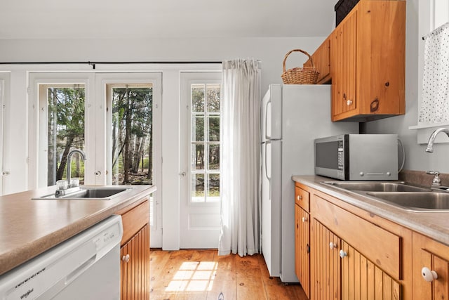 832 Main Rd, Islesboro, ME 04848 - kitchen with white dishwasher, a sink, stainless steel microwave, and plenty of natural light
