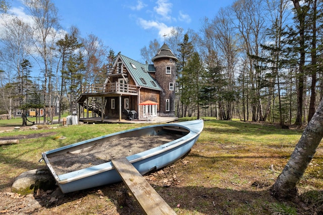 832 Main Rd, Islesboro, ME 04848 - rear view of property with a standing seam roof, a wooden deck, metal roof, a lawn, and stairway
