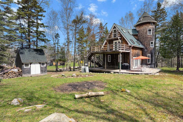 832 Main Rd, Islesboro, ME 04848 - rear view of property featuring a standing seam roof, a deck, an outbuilding, a yard, and a storage shed