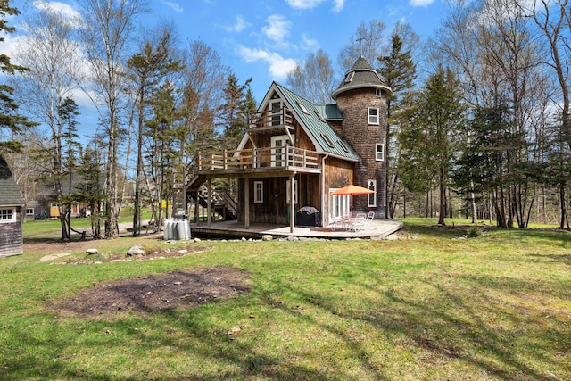 832 Main Rd, Islesboro, ME 04848 - rear view of house with a wooden deck, a standing seam roof, a lawn, and stairway
