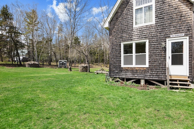 832 Main Rd, Islesboro, ME 04848 - view of grassy yard featuring entry steps and an outbuilding