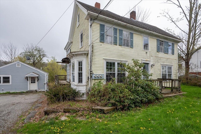 41 Church St, Damariscotta, ME 04543 - view of front facade featuring a chimney, a wooden deck, and a front lawn