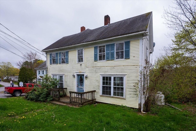 41 Church St, Damariscotta, ME 04543 - back of property featuring a chimney, a wooden deck, and a yard