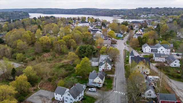 41 Church St, Damariscotta, ME 04543 - aerial overview of property's location with a large body of water, nearby suburban area, and a forest