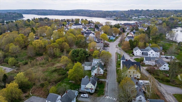 41 Church St, Damariscotta, ME 04543 - aerial overview of property's location with a large body of water, nearby suburban area, and a forest