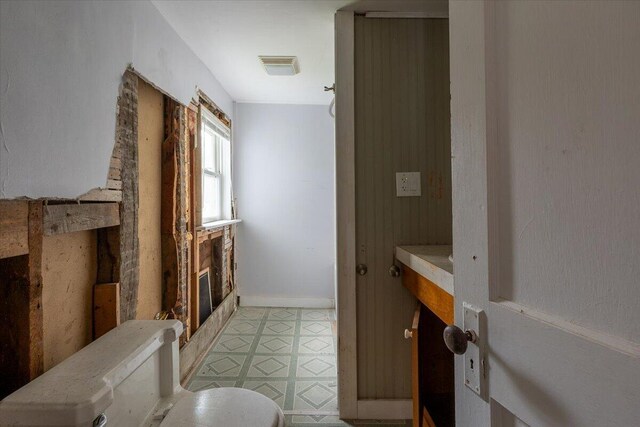41 Church St, Damariscotta, ME 04543 - bathroom featuring tile patterned floors and a glass covered fireplace
