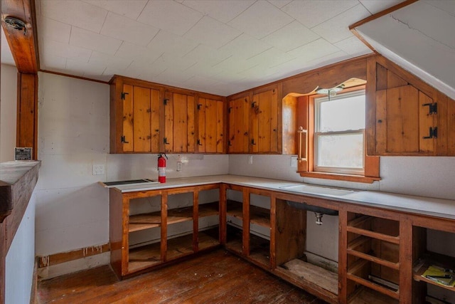 41 Church St, Damariscotta, ME 04543 - kitchen with brown cabinets, dark wood-style floors, light countertops, and lofted ceiling