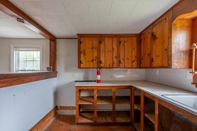41 Church St, Damariscotta, ME 04543 - kitchen featuring brown cabinetry, light countertops, a sink, and baseboards