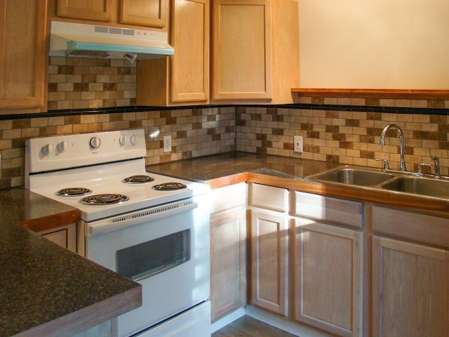 41 Church St, Damariscotta, ME 04543 - kitchen with electric range, under cabinet range hood, a sink, and decorative backsplash