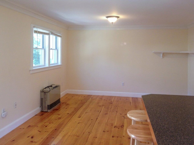 41 Church St, Damariscotta, ME 04543 - unfurnished dining area with ornamental molding, light wood-style floors, heating unit, and baseboards