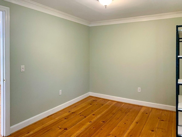 41 Church St, Damariscotta, ME 04543 - empty room featuring crown molding, hardwood / wood-style flooring, and baseboards
