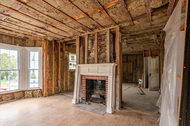 41 Church St, Damariscotta, ME 04543 - unfurnished living room featuring a brick fireplace