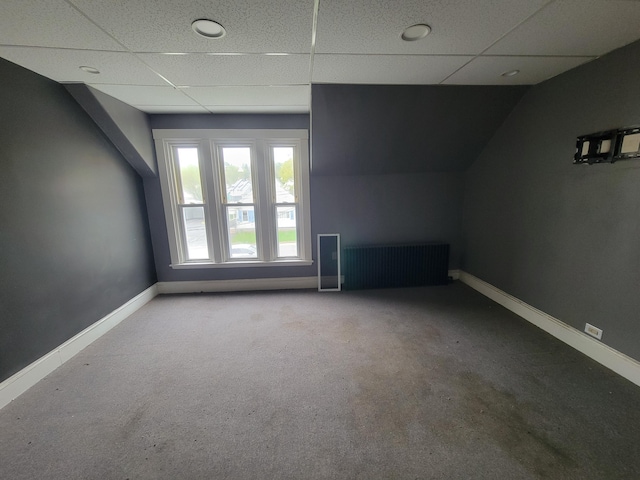 bonus room featuring baseboards and carpet floors