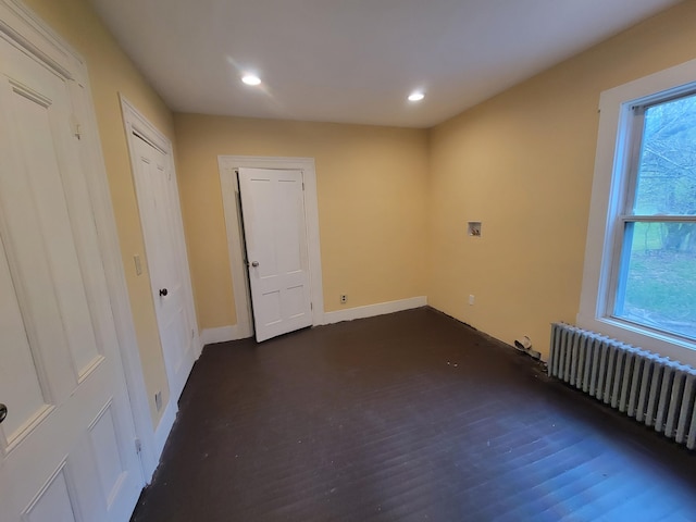 unfurnished bedroom featuring radiator heating unit, recessed lighting, and baseboards