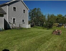 26 Flat Iron Rd, Tremont, ME 04653 - view of home's exterior with a lawn