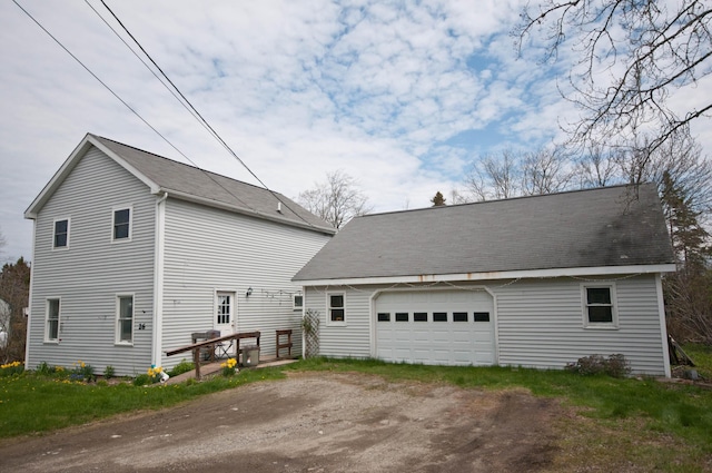 26 Flat Iron Rd, Tremont, ME 04653 - view of side of home with a garage and an outbuilding