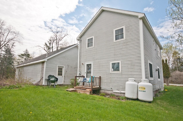 26 Flat Iron Rd, Tremont, ME 04653 - rear view of property featuring a lawn