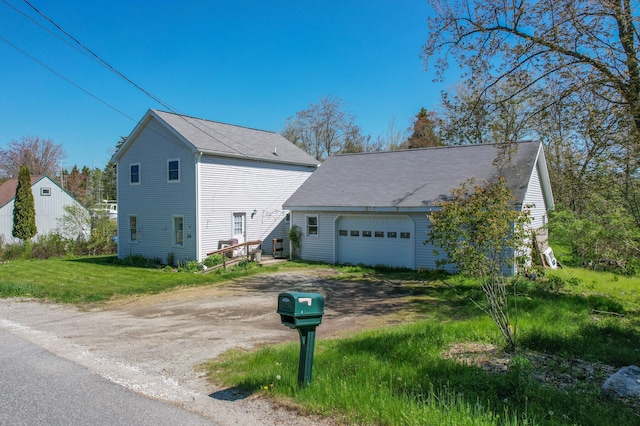 26 Flat Iron Rd, Tremont, ME 04653 - view of side of property featuring driveway and an attached garage
