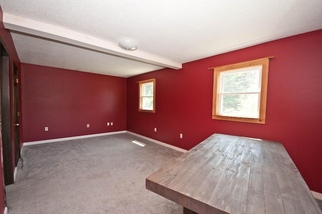 26 Flat Iron Rd, Tremont, ME 04653 - carpeted spare room featuring beam ceiling and baseboards