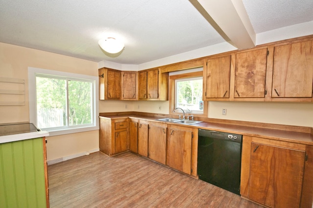 26 Flat Iron Rd, Tremont, ME 04653 - kitchen featuring dishwasher, light wood finished floors, and brown cabinetry