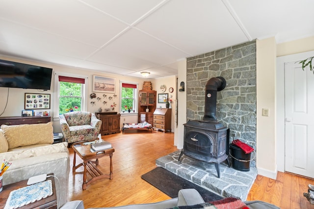 4 Otis St, Rockland, ME 04841 - living room with a wood stove and wood finished floors