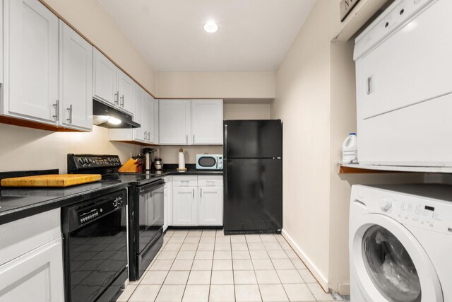 31 Ocean Ave Unit 309, York, ME 03909 - kitchen featuring black appliances, washer / dryer, under cabinet range hood, and dark countertops