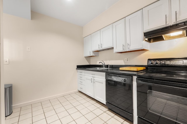 31 Ocean Ave Unit 309, York, ME 03909 - kitchen with black appliances, under cabinet range hood, dark countertops, white cabinets, and baseboards