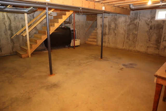 basement with stairway and oil tank