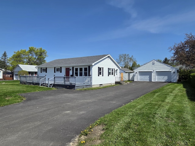 36 Lorraine Ave, Brewer, ME 04412 - view of front of property featuring an outbuilding, a garage, a front yard, a deck, and roof with shingles