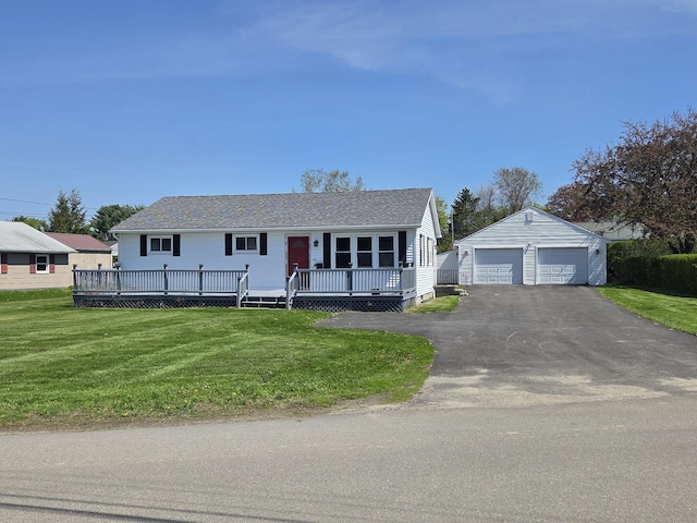 36 Lorraine Ave, Brewer, ME 04412 - view of front of house featuring an outbuilding, a garage, a front yard, a deck, and a shingled roof