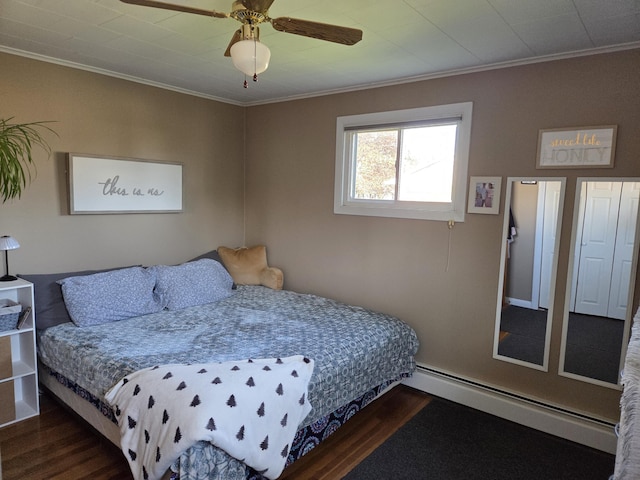 36 Lorraine Ave, Brewer, ME 04412 - bedroom featuring dark wood finished floors, crown molding, baseboard heating, and a ceiling fan