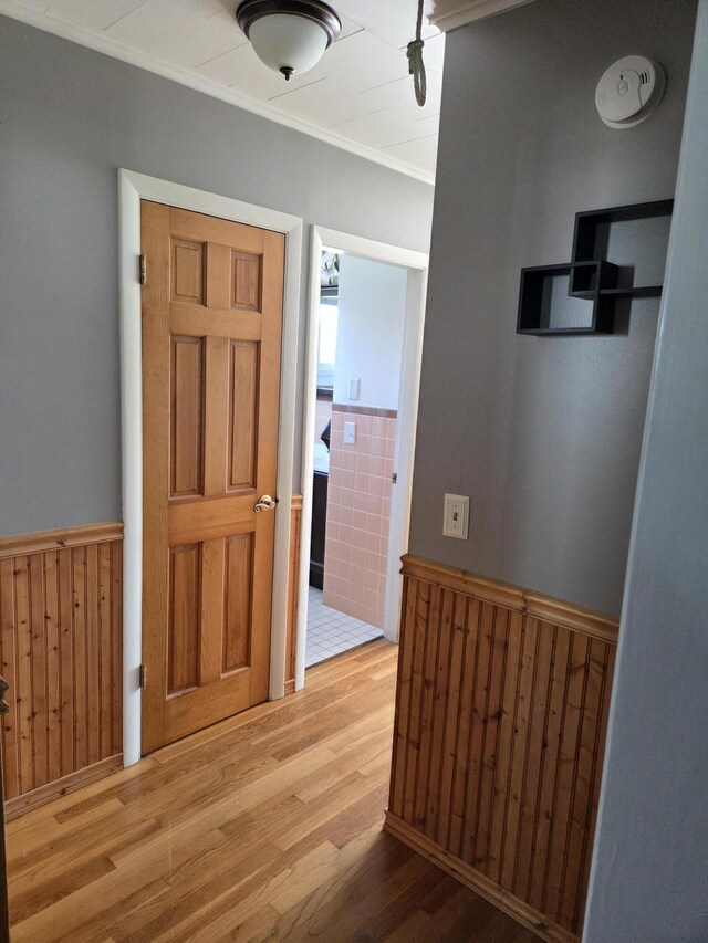 36 Lorraine Ave, Brewer, ME 04412 - foyer entrance featuring a wainscoted wall, wood finished floors, crown molding, and wooden walls