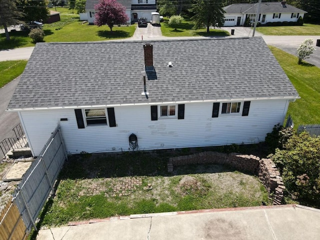 36 Lorraine Ave, Brewer, ME 04412 - back of house featuring roof with shingles and a chimney