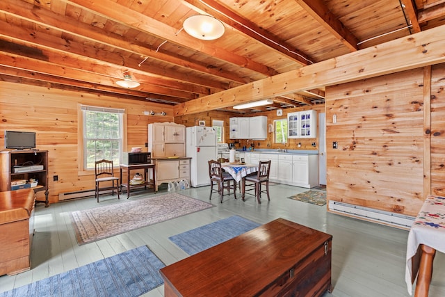 20 Lily Bay Ln, Parsonsfield, ME 04047 - living room with wood ceiling, beam ceiling, wooden walls, wood finished floors, and baseboard heating