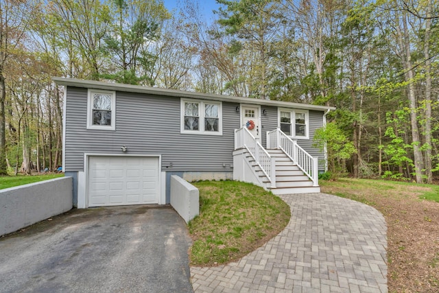 view of front of property with a garage and driveway