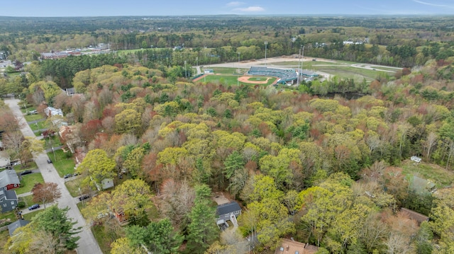 aerial view of property's location with a forest