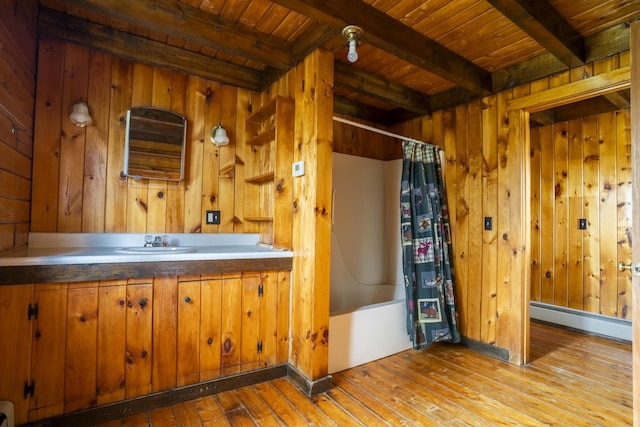526 Range Rd, Dover-Foxcroft, ME 04426 - bathroom with a baseboard heating unit, beamed ceiling, wooden ceiling, hardwood / wood-style floors, and wooden walls
