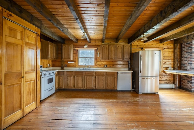 526 Range Rd, Dover-Foxcroft, ME 04426 - kitchen featuring appliances with stainless steel finishes, a sink, light wood-type flooring, beam ceiling, and light countertops