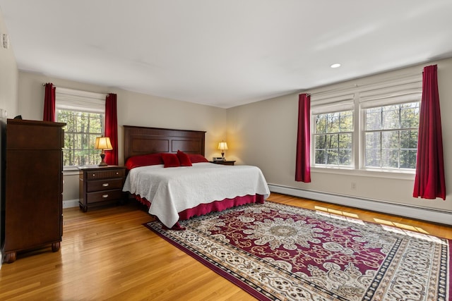 8 Silver Ridge Dr, York, ME 03909 - bedroom with baseboard heating, wood finished floors, recessed lighting, and baseboards