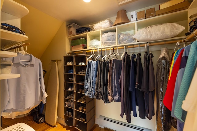 8 Silver Ridge Dr, York, ME 03909 - walk in closet with a baseboard radiator, wood finished floors, and vaulted ceiling