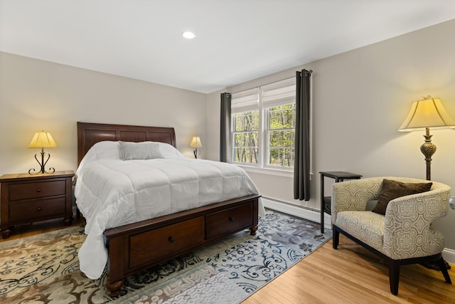 8 Silver Ridge Dr, York, ME 03909 - bedroom featuring a baseboard heating unit, wood finished floors, recessed lighting, and baseboards