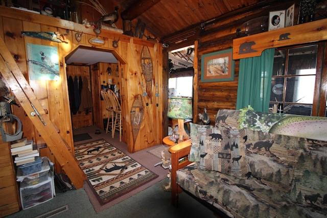 120 S Shore Dr, Rangeley Plt, ME 04970 - interior space with log walls, carpet floors, arched walkways, and wood ceiling