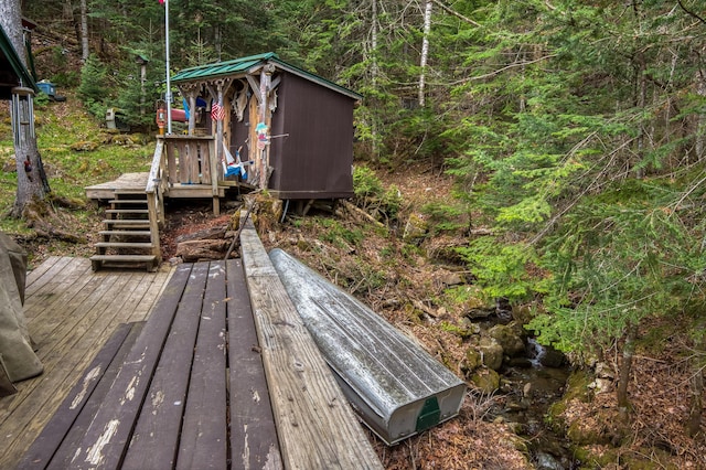 120 S Shore Dr, Rangeley Plt, ME 04970 - wooden terrace featuring a view of trees and stairway