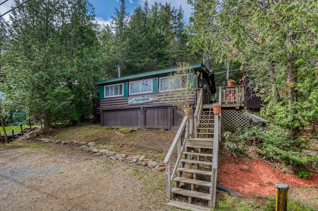 120 S Shore Dr, Rangeley Plt, ME 04970 - view of front facade featuring stairway and a deck