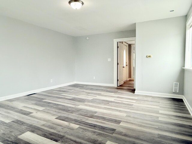 46 French St, Skowhegan, ME 04976 - empty room with wood finished floors and baseboards