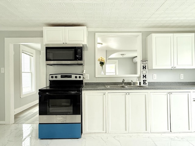 46 French St, Skowhegan, ME 04976 - kitchen featuring appliances with stainless steel finishes, a sink, ornamental molding, white cabinets, and light marble finish flooring