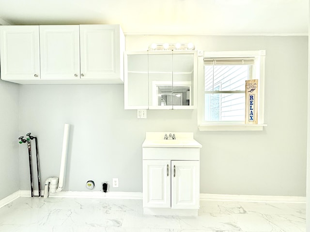46 French St, Skowhegan, ME 04976 - laundry room featuring marble finish floors, baseboards, washer hookup, and hookup for a gas dryer